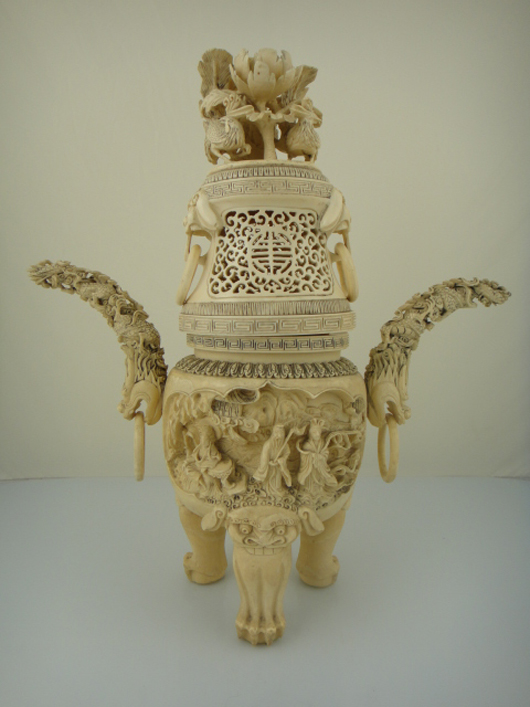 An exceptionally carved ivory tripod censer with longevity ‘shou’ symbol stands 15 inches high with a six-character Qianlong mark on the base. The features a relief carving of three immortals and a dragon and chicken motif design on the handles. Lot 551 is expected to exceed its high estimate of $7,000. Image courtesy of 888 Auctions.